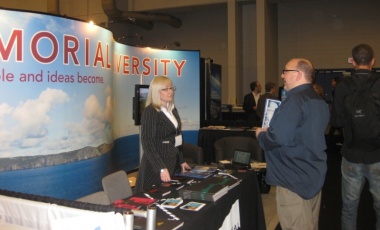 Pictured is Memorial's booth at the International Polar Year conference, titled From Knowledge to Action, running April 22-27 in Montreal, Que. Twenty-five delegates from Memorial are participating in the event to share their work related to climate change, northern development and sustainable tourism. Events co-ordinator with the Division of Marketing and Communications Jessica Fisher, at left, is seen speaking with a conference attendee.